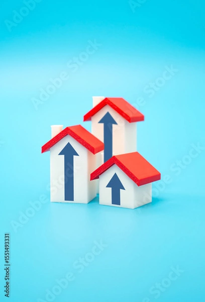 Fototapeta Houses with arrows pointing up. Concept of real estate market growth, price and value. Investment and capital savings in the form of real estate. Rising property demand. Mortgage trends