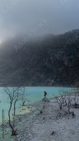 Fototapeta Photographer taking pictures at Kawah Putih, a misty volcanic crater lake in Ciwidey, West Java, Indonesia. 