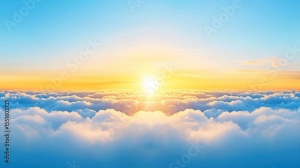 Obraz Sunset over clouds with emerging sunlight through fog in a scenic sky view
