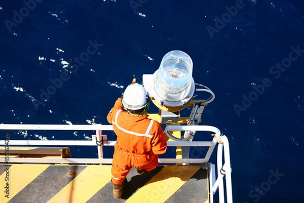 Fototapeta Technician repaired and replaced equipment on oil and gas platform, Performed preventive maintenance and corrective maintenance equipment of oil and gas platform, Safety condition concept.