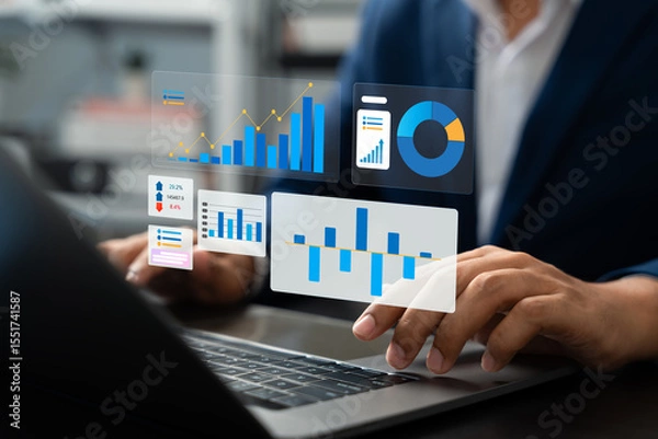 Fototapeta Professional businessman using laptop to review performance indicators, Business growth charts, Market research data for financial and investment decisions. Strategic planning and corporate success.