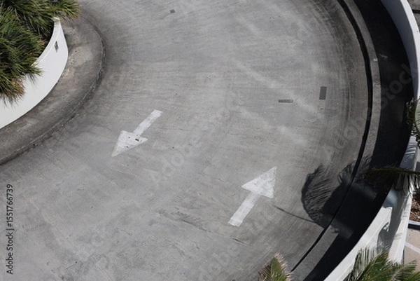 Fototapeta Opposite side sign straight white arrow on gray asphalt and concrete show a direction forward and backward