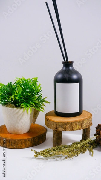 Obraz reed diffuser bottle with plain white label on the wooden podium minimalist studio scene