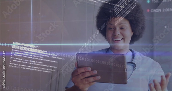Obraz Smiling nurse wearing scrubs using tablet in clinic hallway, with stethoscope, data, copy space