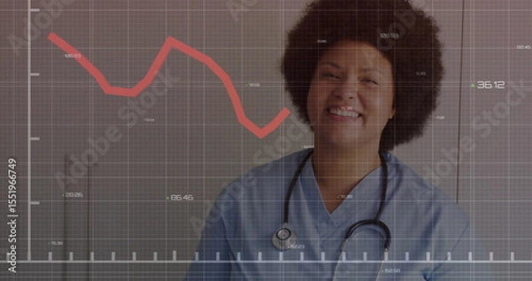 Obraz Smiling nurse wearing scrubs standing in clinic, with stethoscope and red graph overlay, copy space