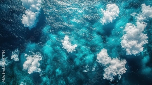Fototapeta Aerial View of Turquoise Ocean with Clouds and Deep Blue Water