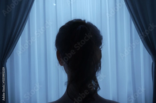 Fototapeta back of woman's head behind sheer curtains at night. 3D Rendering
