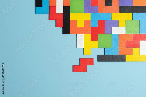 Obraz geometric shape block with colorful wood puzzle piece background. logical thinking, business logic, Conundrum, decision, solutions, rational, mission, success, goals and strategy concepts