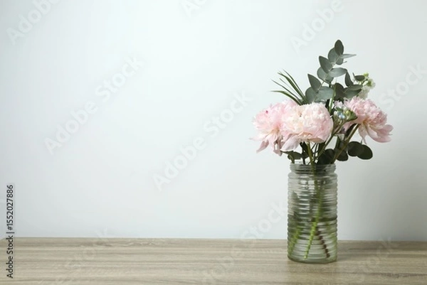 Fototapeta Beautiful bouquet with pink peonies in a vase on the table