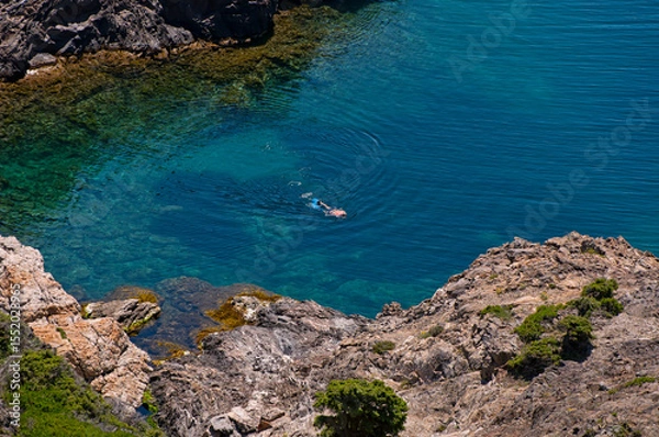 Fototapeta Swimmer in a hidden cove
