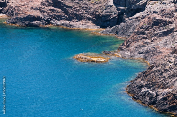 Fototapeta Crystal clear waters and rocky shore