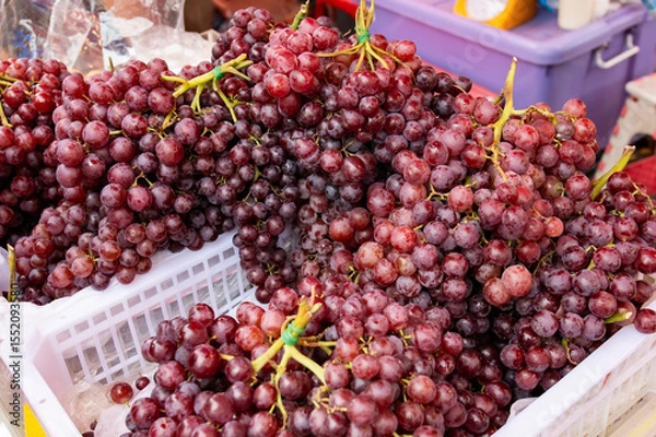 Obraz Red grapes in a plastic basket