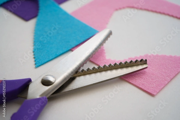 Obraz The scissors rest on the felt scraps. Embroidery and stitching.