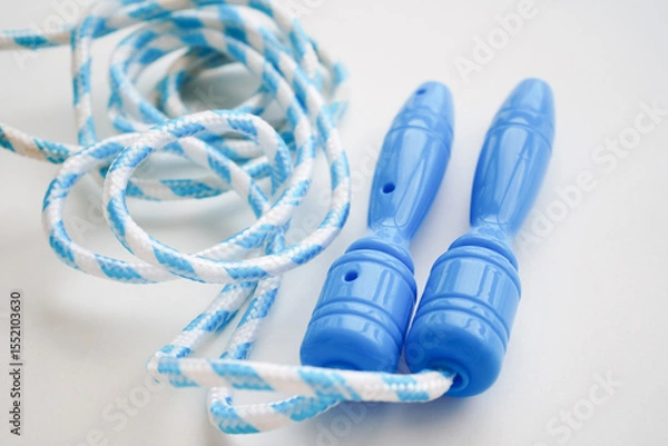 Obraz Blue skipping rope isolated on white, top view. Sports equipment