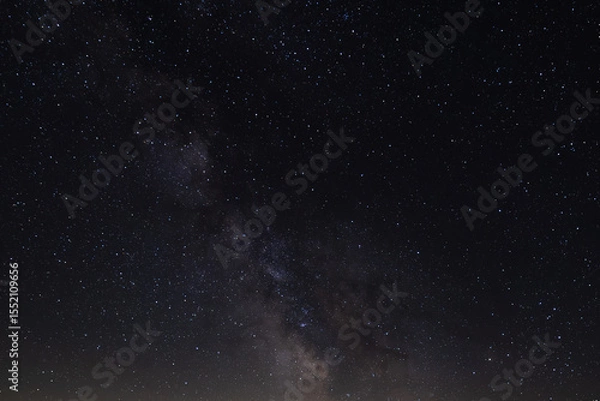 Obraz A breathtaking view of the Milky Way galaxy sprawling across the night sky, capturing the beauty of the cosmos