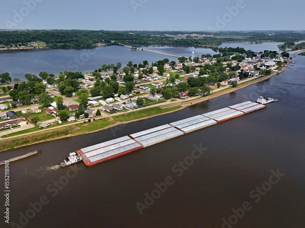 Obraz Aerial view of Sabula, Iowa with tub boats and barges on the Mississippi River in the foreground