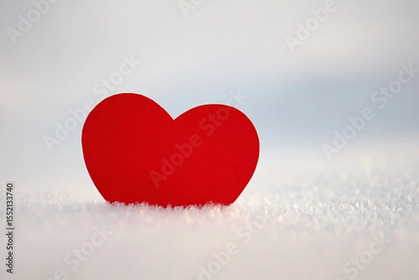 Fototapeta Happy Valentine's Day celebration. The concept of love in the form of a heart. Postcard dated February 14th, red heart in the snow, a place for the text. Winter holidays. Paper red heart