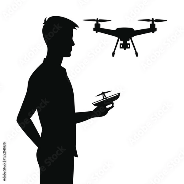 Fototapeta Silhouette of man holding drone controller with drone in air