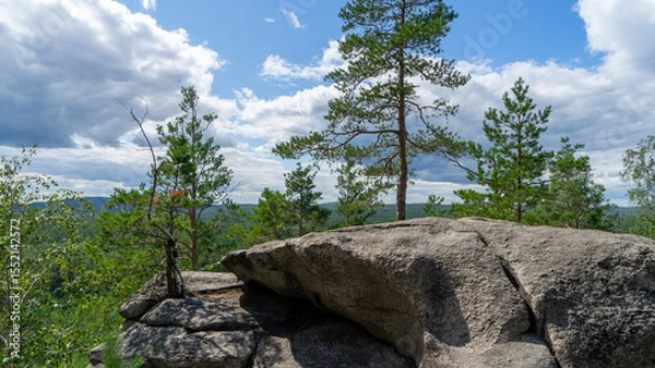 Fototapeta Small Devils rock, Devil's Hillfort complex on sunny summer day. Iset Park, Iset village, Sverdlovsk region, Russia. Hiking. Pine trees on rock