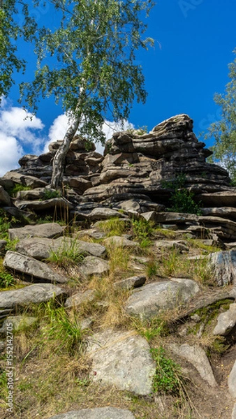 Fototapeta Devil's Hillfort complex on sunny summer day. Iset Park, Iset village, Sverdlovsk region, Russia. Hiking and walking.  Vertical image