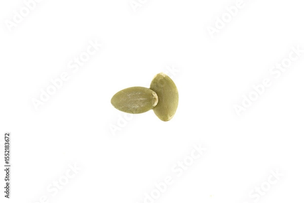 Obraz Top view of two peeled pumpkin seeds on white background.