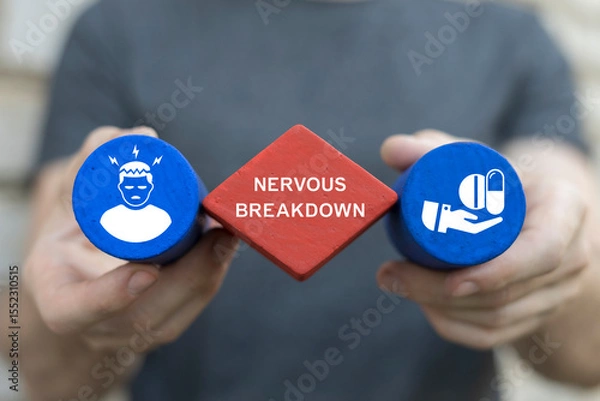 Fototapeta Exhausted person holding colored blocks with icons sees the inscription: NERVOUS BREAKDOWN. Nervous breakdown concept. Tired emotional person struggle with stress and overwork.