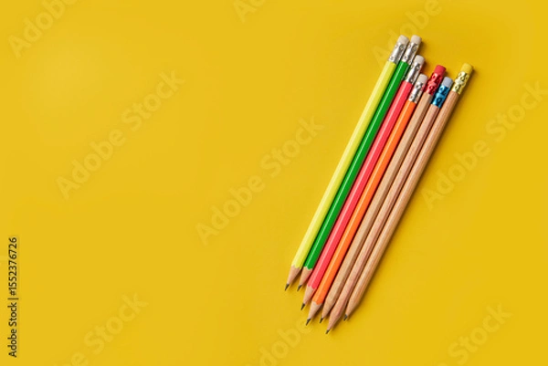 Obraz Group of pencils on yellow background. Top view
