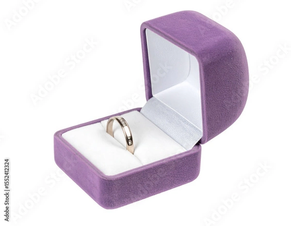 Obraz A simple, silver band rests inside a purple velvet ring box, subtly hinting at a proposal or special occasion