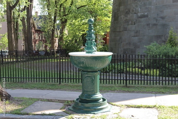 Fototapeta A beautiful and antique fountain for horse in the old Quebec. Water and fountain.  Urban and outdoor architecture. 
