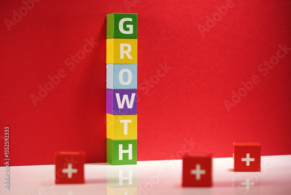 Obraz stack of toy blocks with text Growth against red background