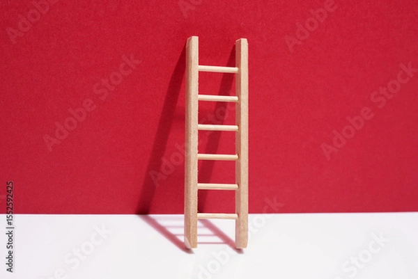 Obraz small ladder against red background