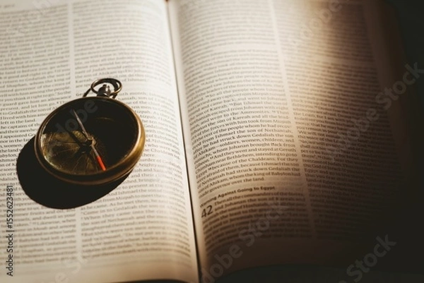 Obraz Pocket watch on open book