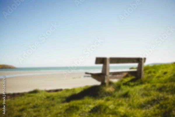 Obraz Empty bench by grass at beach