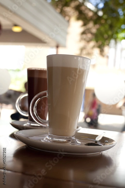 Fototapeta coffee latte and hot chocolate in tall glasses on cafe backgroun
