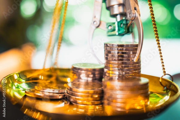 Fototapeta A robotic arm balances money coins in a golden scale, illustrating AI's role in optimizing investment allocation to achieve the right risk-adjusted balance.