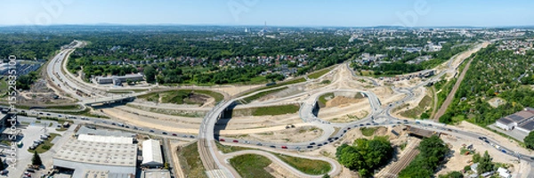 Fototapeta Krakow, Poland. Grebalow large highway and tramway interchange under construction. The fragment of S7 from Warsaw to A4 and last fragment of ring road around Krakow. Aerial view. State in January 2025