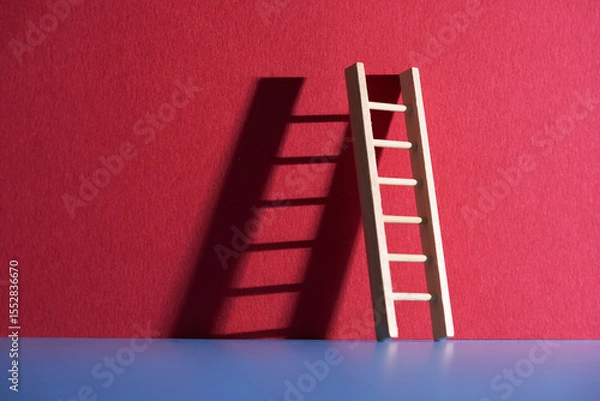 Obraz step ladder lening against red background