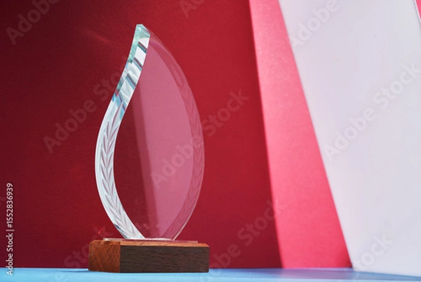 Obraz crystal trophy against red background.