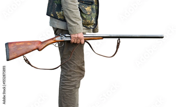 Fototapeta Mature man hunter with gun while walking on field.