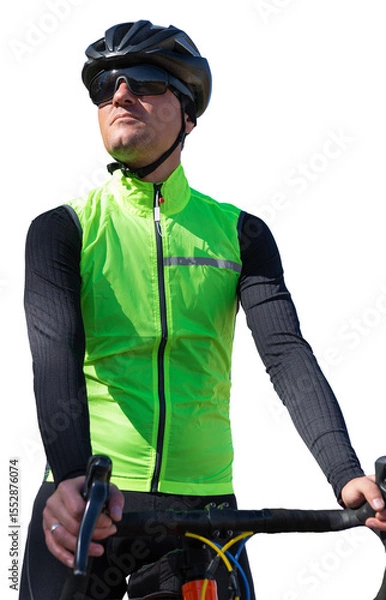 Fototapeta A man in clothes stands with a bicycle on an autumn sunny day. Cyclist in the park.