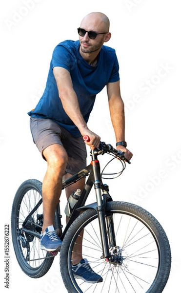 Fototapeta A man in casual clothes stands with a bicycle on a summer sunny day.
