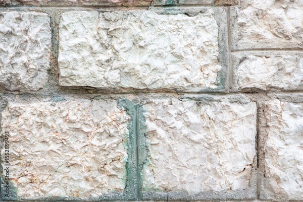 Fototapeta Close-Up of a Textured Stone Wall with Light and Neutral Tones
