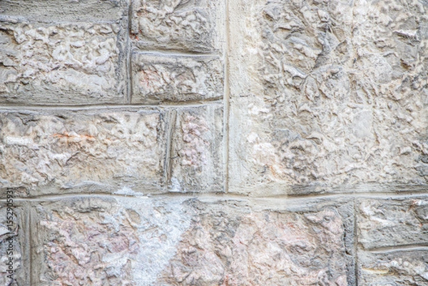 Fototapeta Close-Up of a Textured Stone Wall with Light and Neutral Tones
