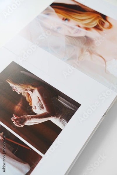 Obraz the pages of a photo book with wedding photos. 