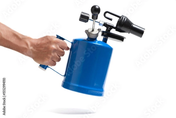 Obraz Hand holding blue blowtorch, highlighted on white background.