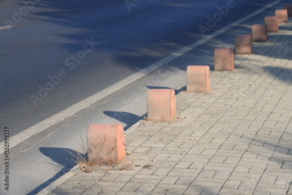 Fototapeta Gray curb on background of flowers, minimalism, path in the park, 7