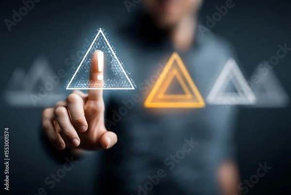Fototapeta High quality photo of person holding an exclamation mark with a triangle on their hand, signifying a warning or point of attention. The background is dark gray, and the focus is.