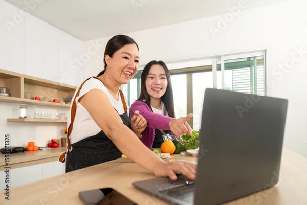 Obraz Cooking Class: Women Using Laptop for Recipe Inspiration