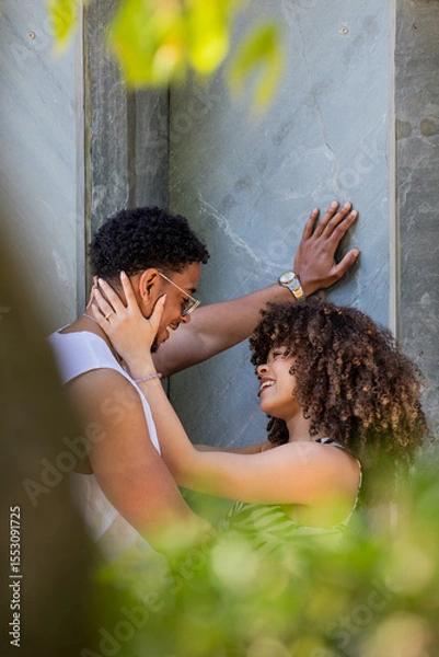 Obraz young latin couple on the street with an affectionate gesture