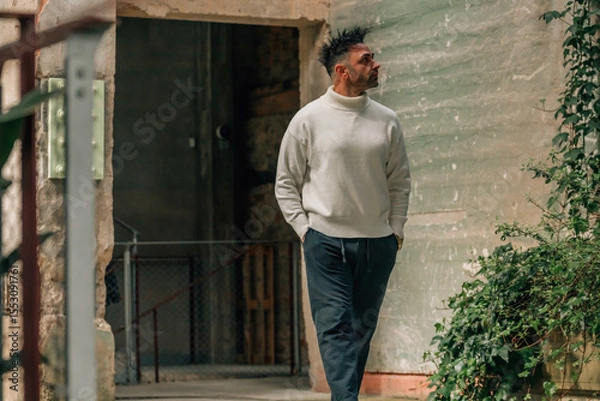 Obraz adult man visiting or traveling walking in ancient monument